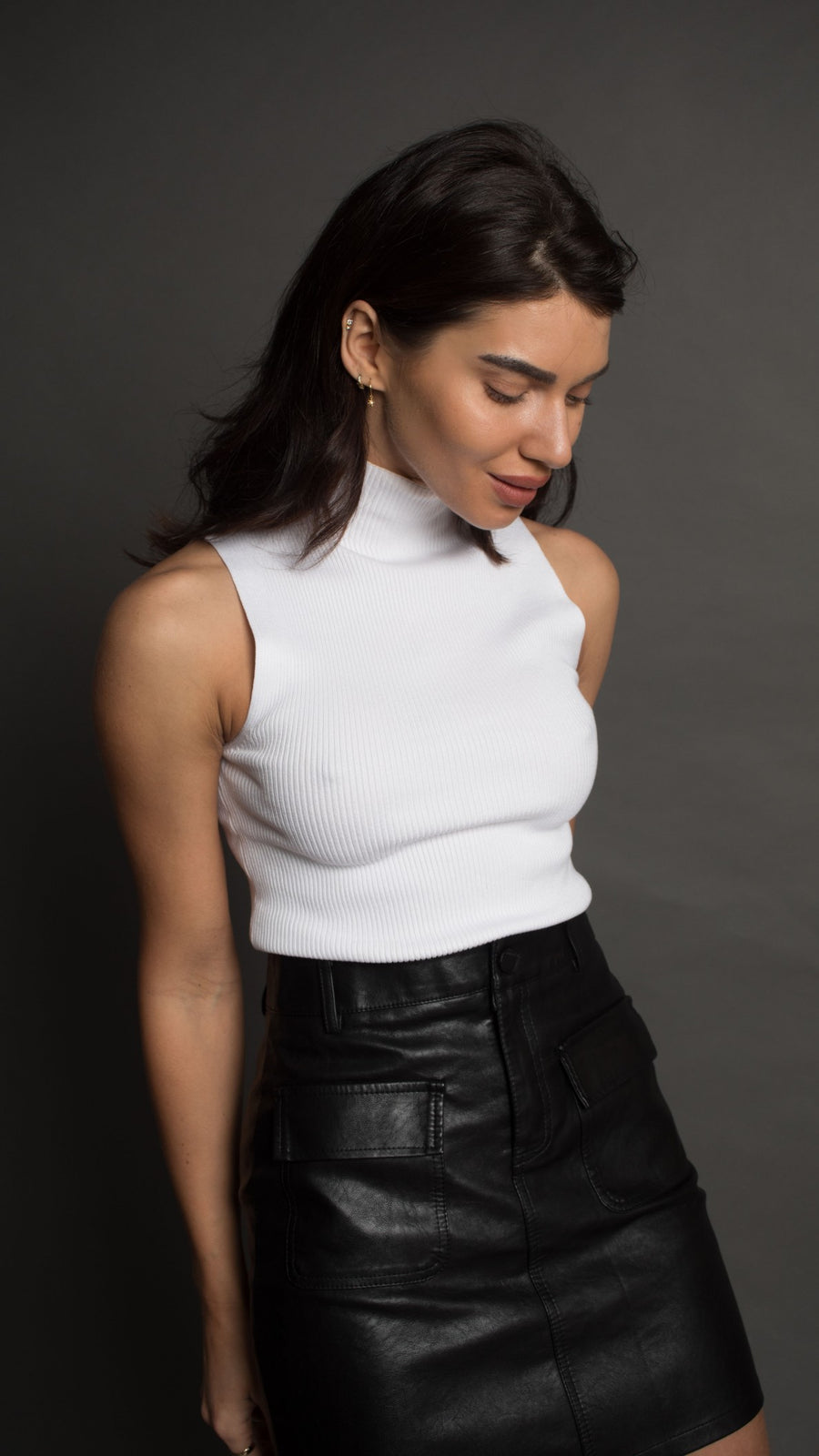 White sleeveless turtle neck